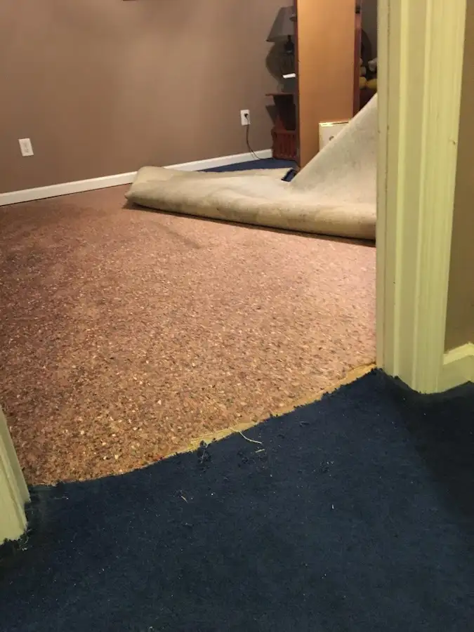 Carpet pad removal revealing water damage during Drying & Dehumidification in Rancho Cucamonga